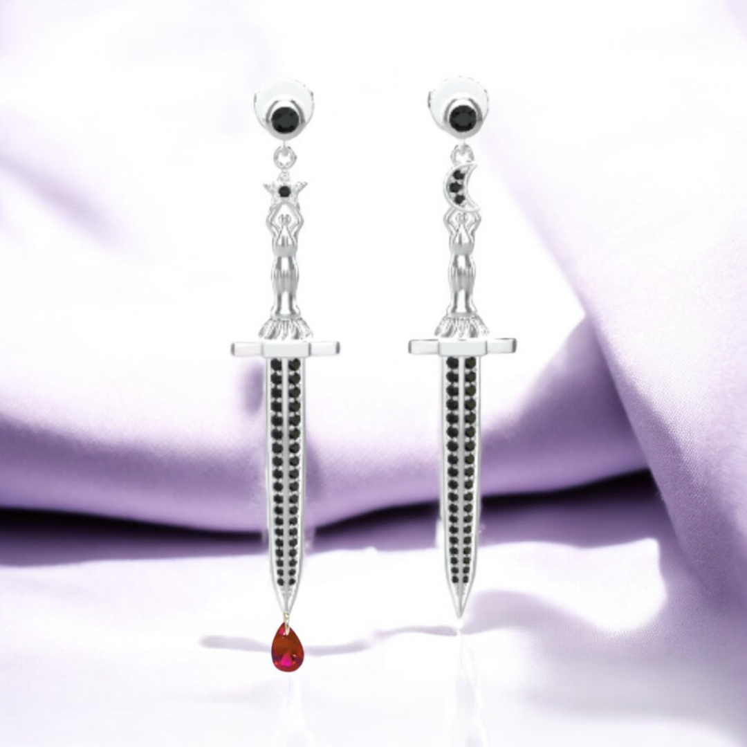 Vermeil or sterling silver Bloodstone Blade Earrings featuring a lab ruby blood drop with white or black moissanite accents on a striking sword design.