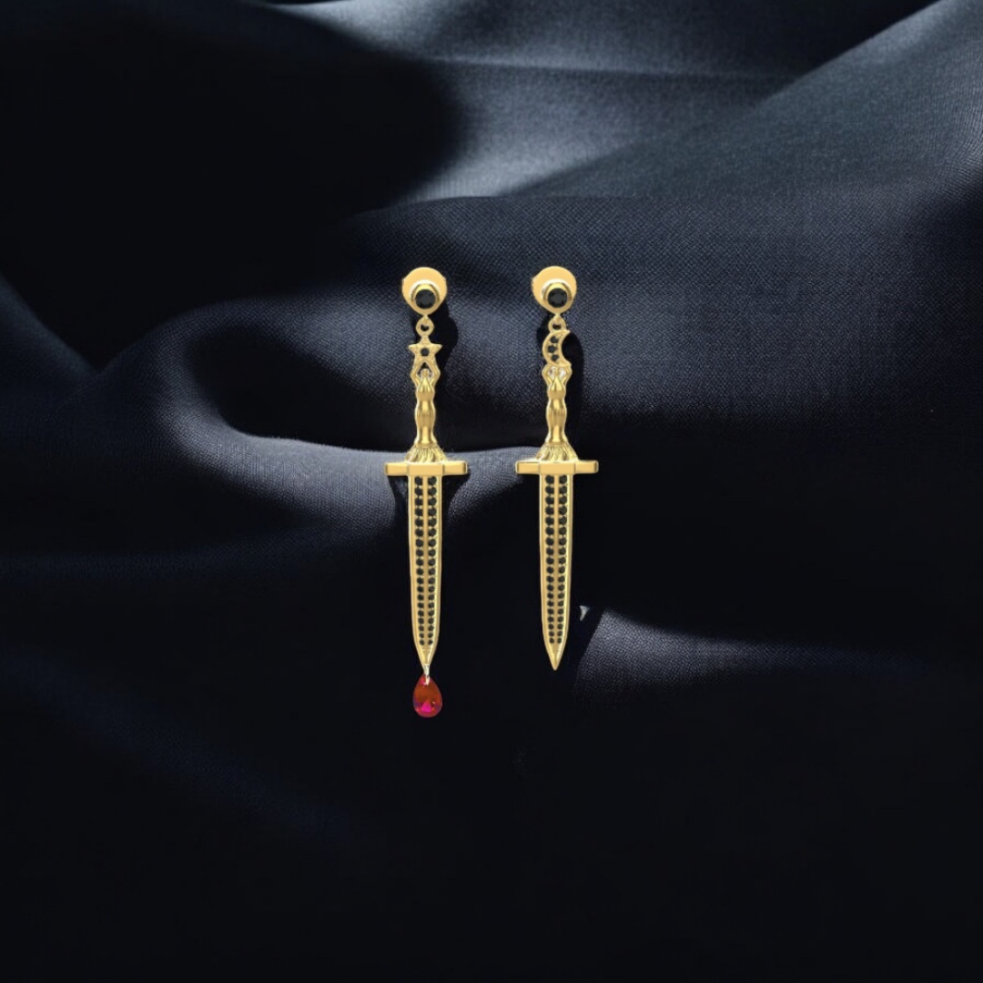 Vermeil or sterling silver Bloodstone Blade Earrings featuring a lab ruby blood drop with white or black moissanite accents on a striking sword design.