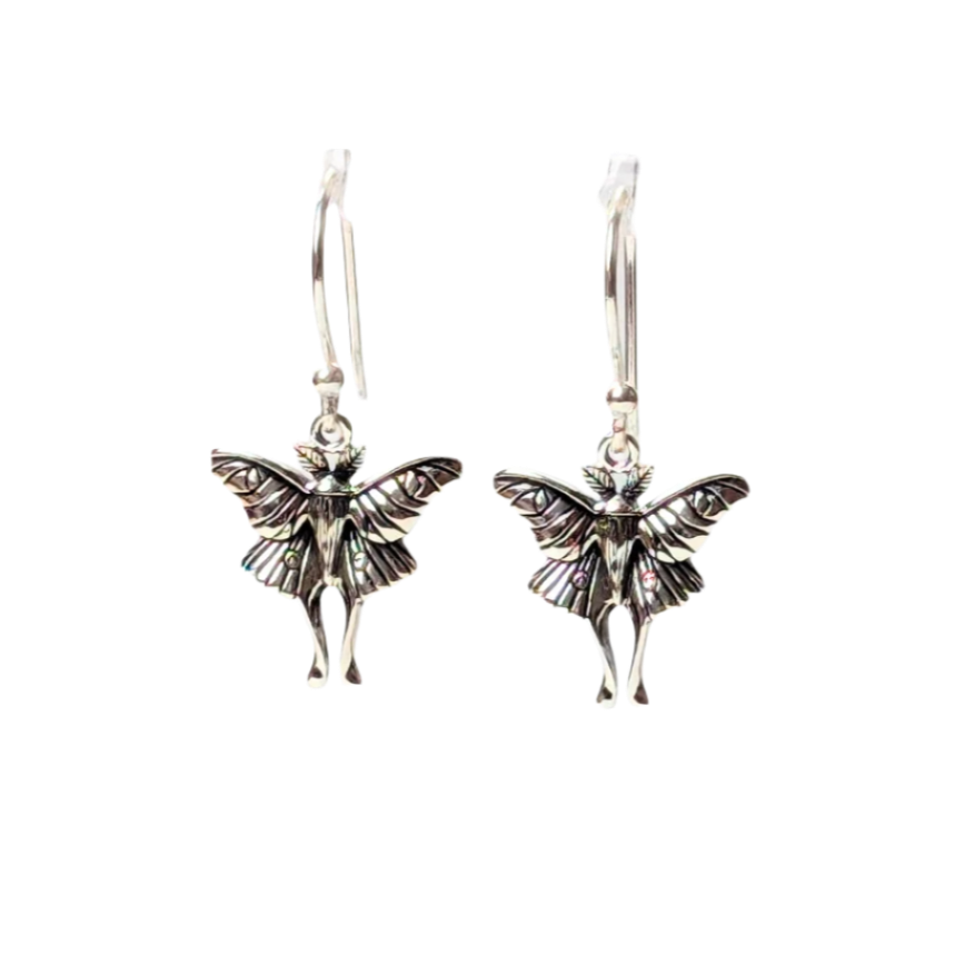 A pair of sterling silver Luna Nocturne Earrings featuring intricately sculpted luna moths with finely etched wings and elongated hindwings, suspended from silver ear wires.