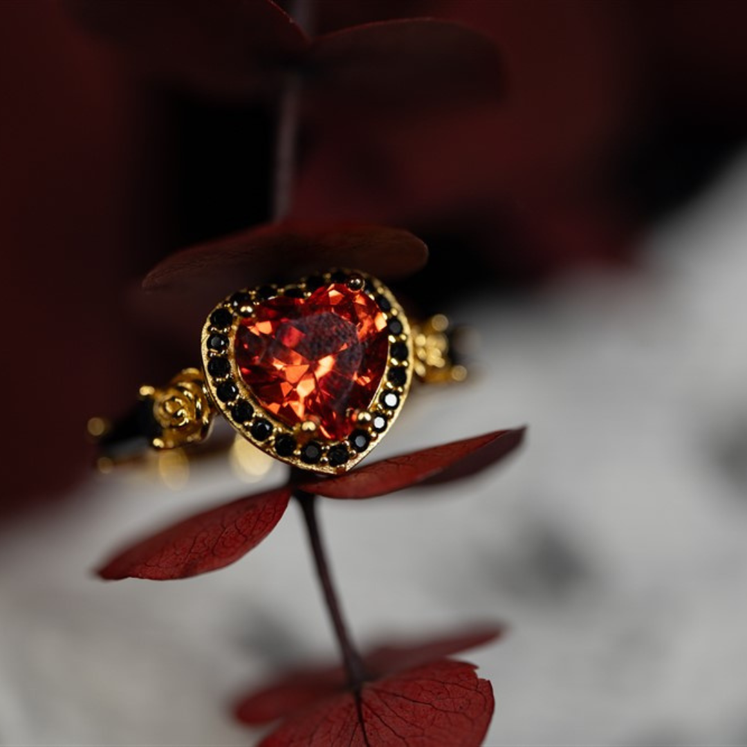 Masquerade Ring in 14k yellow gold with heart-shaped gemstone, black stone halo, and coffin-cut accents