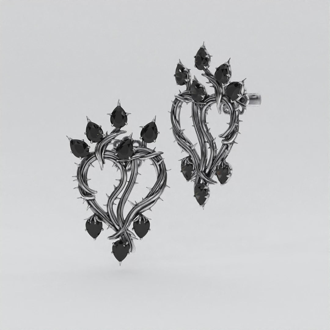 Thorned Heart Earrings crafted from blackened silver with black moissanite.